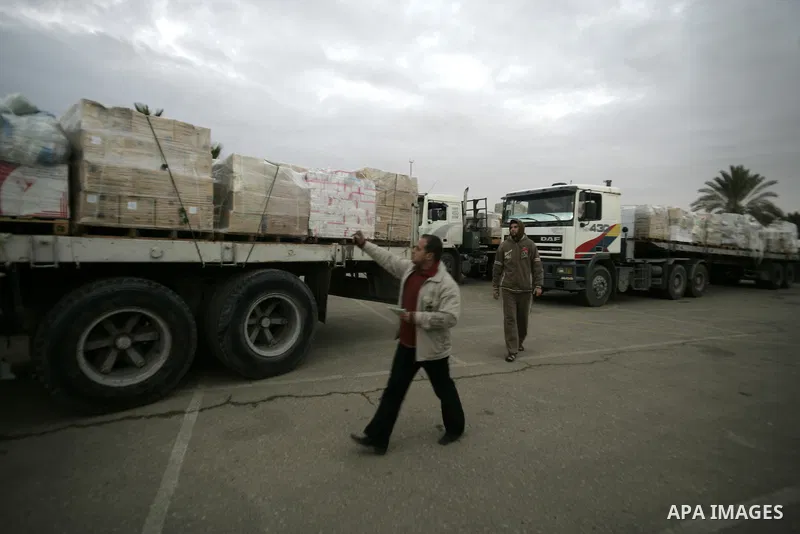 Palestinian trucks carrying aid Asia 1 reach the Gaza Strip through the Rafah crossing border between Egypt and Gaza after the Egyptian authorities allowed for the aids to enter Gaza Strip on January 6, 2011. Photo by Ab...