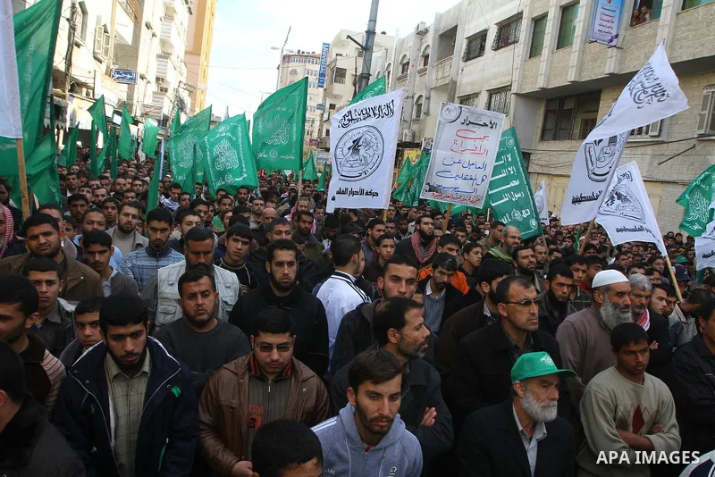 Palestinian Hamas supporters take part in a rally in Gaza city against Mahmud Abbas Authority on Jan. 7,2011. A Palestinian man was shot dead by Israeli soldiers during a raid in the West Bank to arrest suspected militan...
