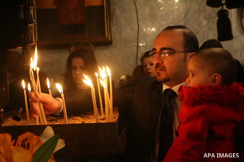 Palestinian Greek Orthodox worshipers attend Christmas services at a Greek Orthodox church in Gaza City, Friday, Jan. 7, 2011. Christmas falls on Jan. 7 for Orthodox Christians in Eastern Orthodox churches that use the J...