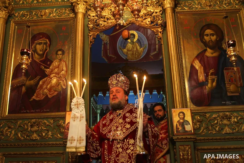 Palestinian Greek Orthodox worshipers attend Christmas services at a Greek Orthodox church in Gaza City, Friday, Jan. 7, 2011. Christmas falls on Jan. 7 for Orthodox Christians in Eastern Orthodox churches that use the J...