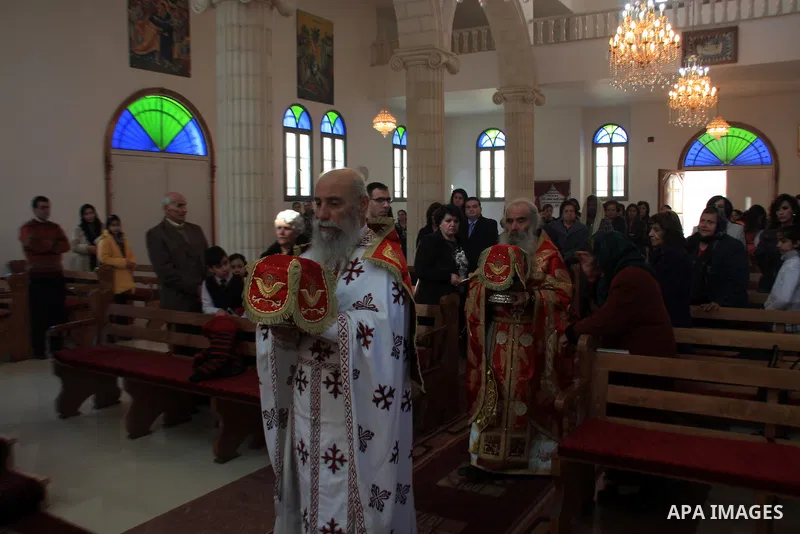 Palestinian Greek Orthodox worshipers attend Christmas services at a Greek Orthodox church in the West Bank city of Nablus, Friday, Jan. 7, 2011. Christmas falls on Jan. 7 for Orthodox Christians in Eastern Orthodox chur...