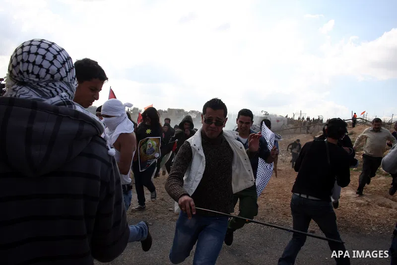 Isareli soldiers disperse protesters in the village of Bilin on January 7, 2011. Israeli troops in Hebron shot dead an elderly Palestinian civilian on Friday in a case of mistaken identity as they searched for a Hamas pr...