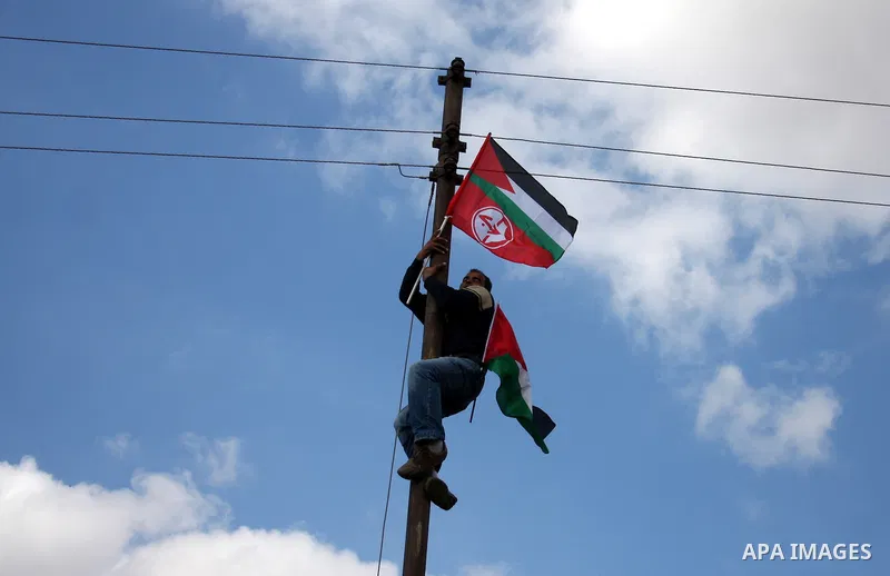 Palestinians take part in a protest in the village of Bilin on January 7, 2011. Israeli troops in Hebron shot dead an elderly Palestinian civilian on Friday in a case of mistaken identity as they searched for a Hamas pri...