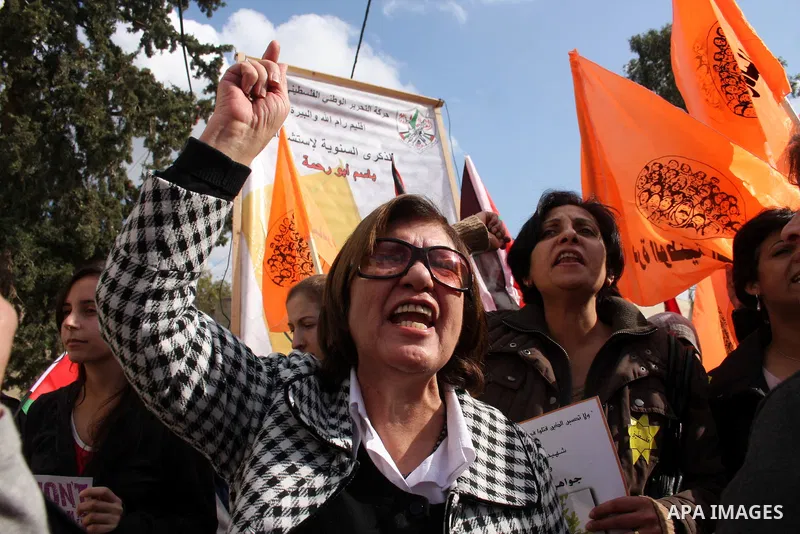 Palestinians take part in a protest in the village of Bilin on January 7, 2011. Israeli troops in Hebron shot dead an elderly Palestinian civilian on Friday in a case of mistaken identity as they searched for a Hamas pri...