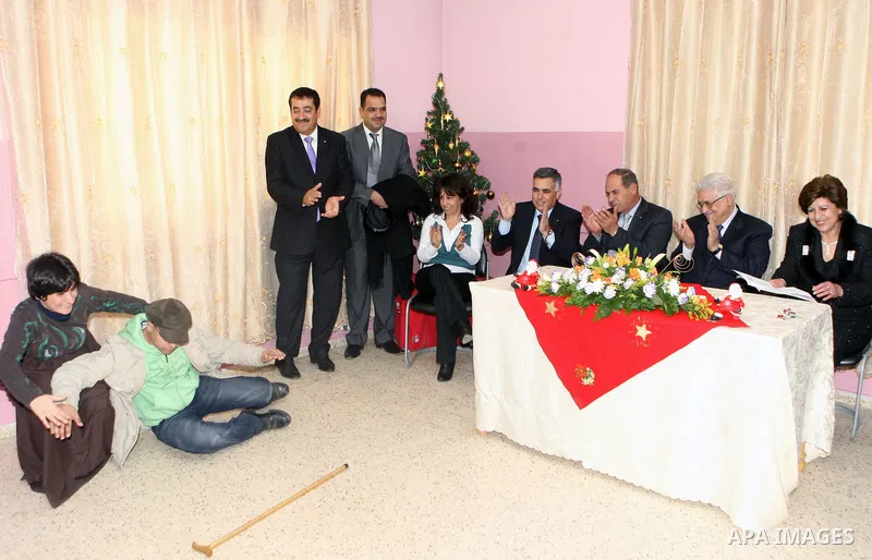 Palestinian President Mahmoud Abbas during a visit to Basma Centre for rehabilitation of disabled persons, in Beit Sahour town east of Bethlehem on Jan. 7, 2011. Photo by Thaer Ganaim