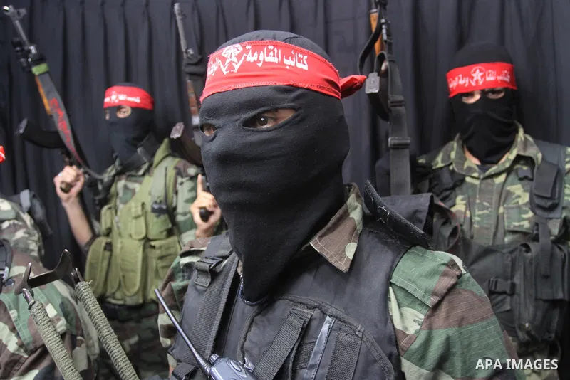 Palestinian fighters from National Resistance Brigades attend a press conference about the clashes with Israeli soldiers which killed an Israeli soldier and wounded 4 others east of the Bureij camp, Gaza City on Jan. 8,...