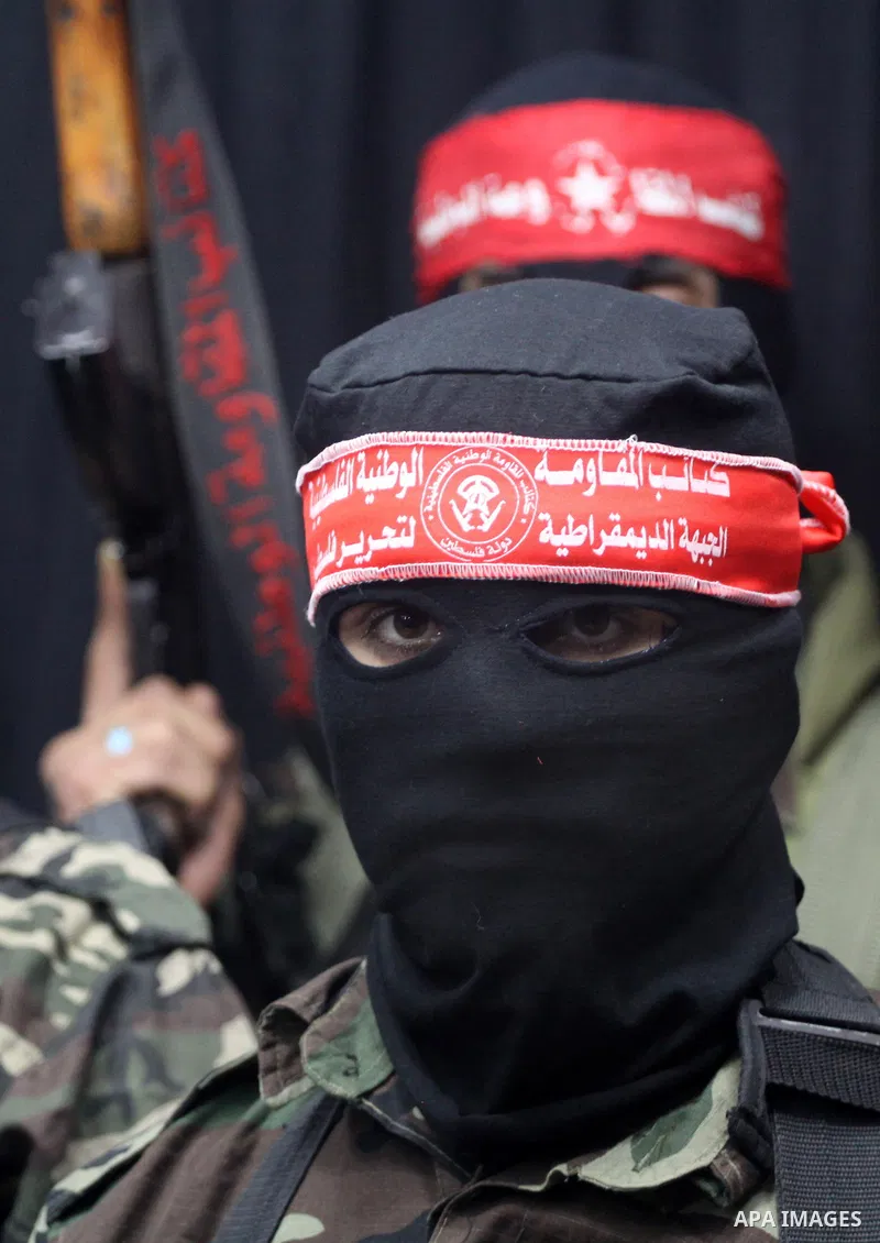 Palestinian fighters from National Resistance Brigades attend a press conference about the clashes with Israeli soldiers which killed an Israeli soldier and wounded 4 others east of the Bureij camp, Gaza City on Jan. 8,...