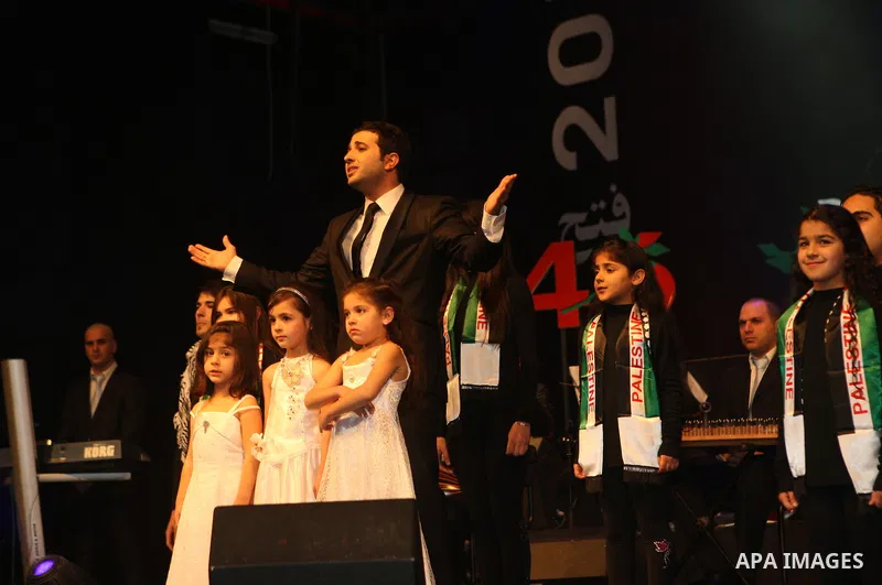 Palestinian President Mahmoud Abbas (not seen) attends the ceremony organized by Palestine TV, on the occasion of the launch of the Palestinian revolution, in the West Bank City of Ramallah, on Jan. 8, 2011. Photo by Tha...