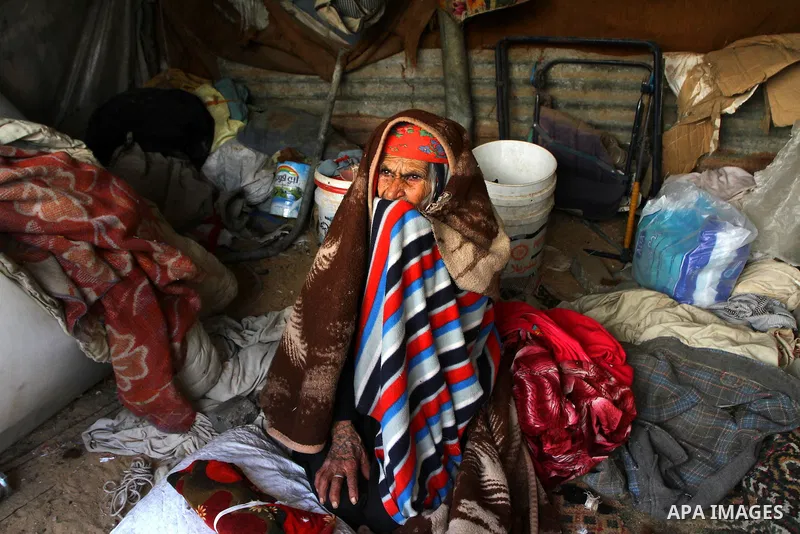 A Palestinian Bedouin woman sits in her tent in Gaza City on Jan. 9,2011. Photo by Ashraf Amra