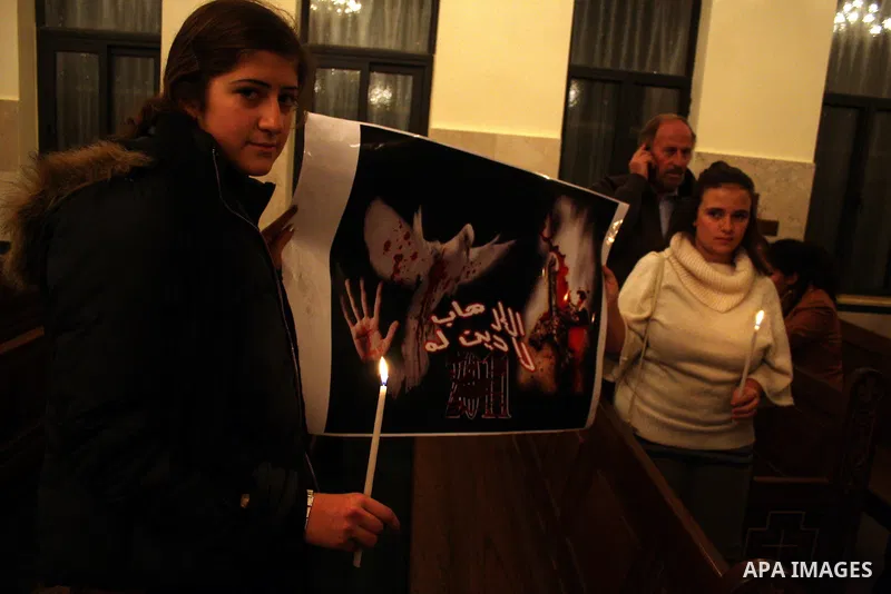 Palestinian Christians light candles at the Copts church in the West Bank city of Ramallah on January 9, 2011 to .A powerful bomb, possibly from a suicide attacker, exploded in front of a Coptic Christian church in Alexa...