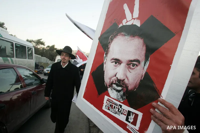 Demonstrators protest across the street from what remains of the Shepherd Hotel in the Sheikh Jarrah neighborhood in East Jerusalem during a protest against Jewish settlement of Arab East Jerusalem following the building...