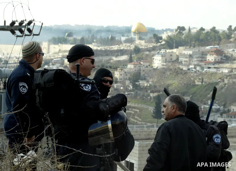 Israeli soldiers take position during a demolishing to horse stable for a Palestinian as Israeli army say that the stable was built without a construction permit, in the Arab Jerusalem neighborhood of Wadi al-Joz, on Jan...