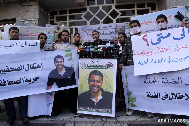 Palestinian journalists attend a protest against arrests of the journalists by the security forces in the West Bank, Gaza City on Jan. 11, 2011. Photo by Mohammed Asad