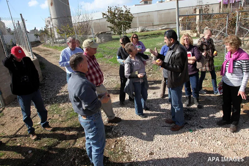 International academics visit Hashlamoun Organic Farm to see the suffering of the Palestinian farmers from the lack of water, in the Palestinian city of Hebron on January 11, 2011. Photo by Najeh Hashlamoun