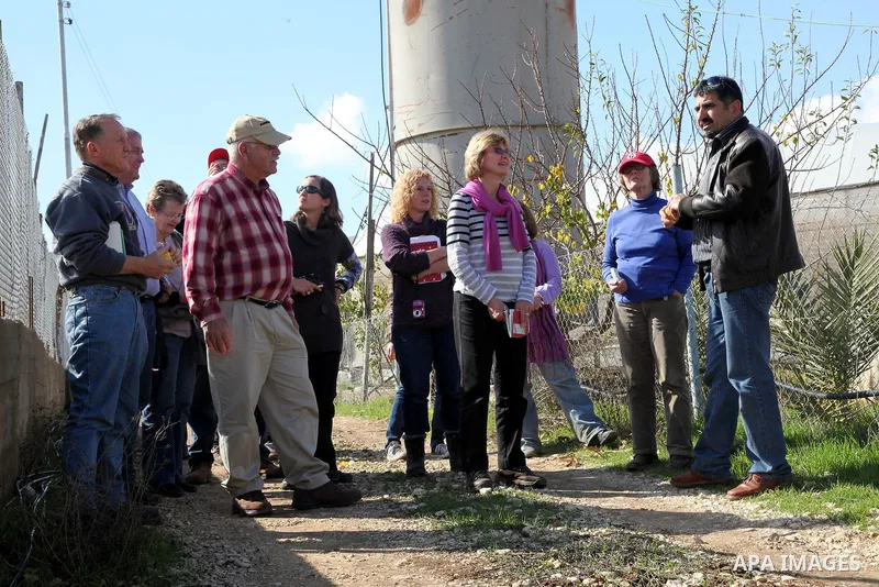 International academics visit Hashlamoun Organic Farm to see the suffering of the Palestinian farmers from the lack of water, in the Palestinian city of Hebron on January 11, 2011. Photo by Najeh Hashlamoun