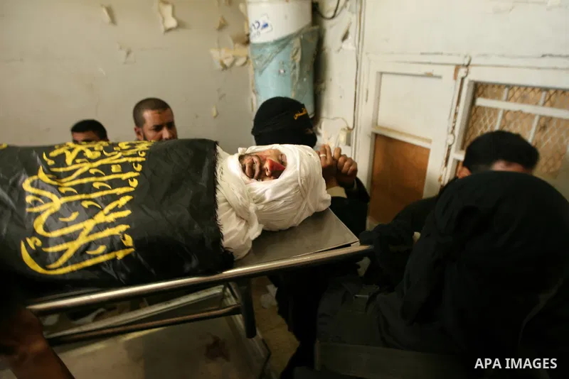 Palestinian militants from the Islamic Jihad carry the body of Mohamed al-Najjar, who was killed during an Israeli air strike the previous day, during his funeral in Khan Yunis, southern Gaza Strip, on January 12, 2011....