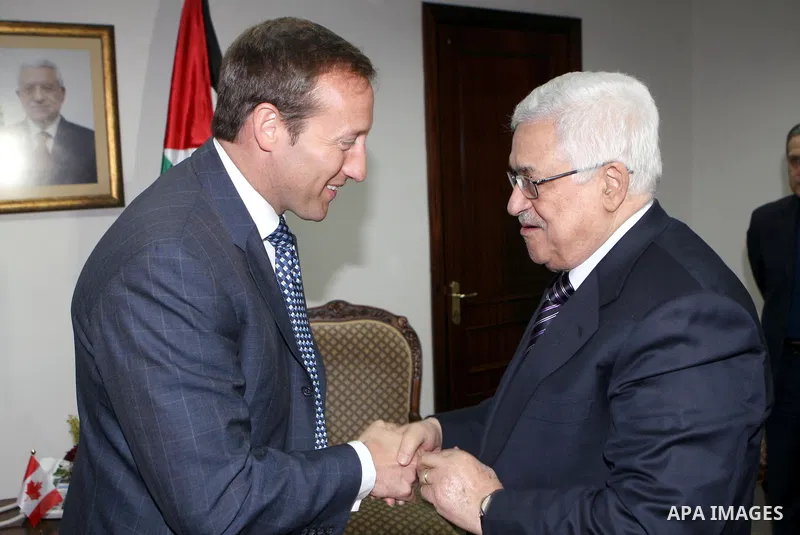 Palestinian President Mahmoud Abbas (R) during a meeting with the Canada's Defense Minister Peter MacKay , in the West Bank city of Ramallah on January 12, 2011. Photo by Thaer Ganaim