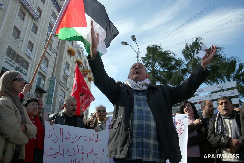 Palestinians take part in a protest against prices rising and high taxes in the West Bank city of Ramallah on Jan. 12, 2011. Fuel prices rises 5% as more than 150,000 Palestinian families considers under the poverty line...