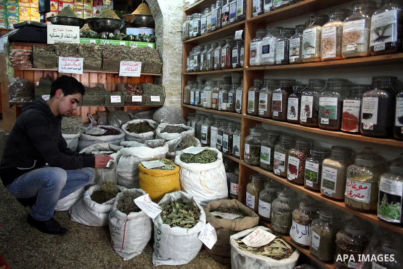 Palestinians display their goods at a food store in the West Bank city of Hebron on January 13, 2011. Photo by Najeh Hashlamoun