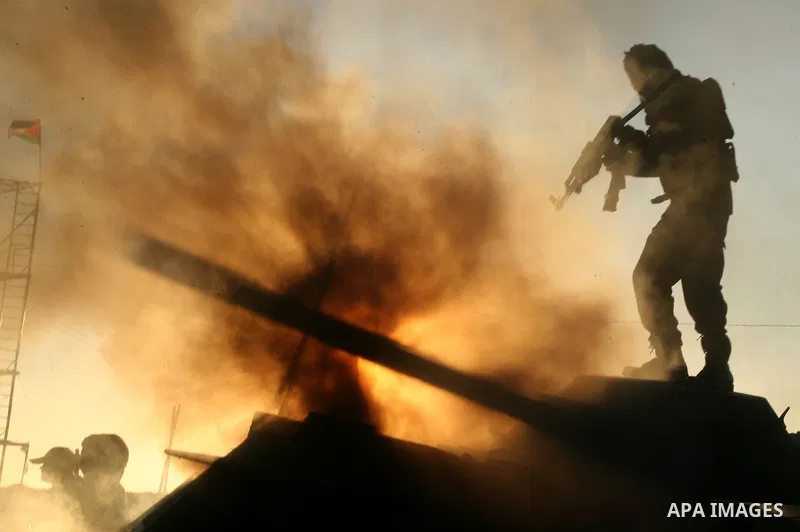 Palestinian fighters from the al-Ahrar Brigades (Freemen Brigade), an Islamist coalition of militants based in the Gaza Strip, show their skills during a training session in Khan Yunis in southern Gaza on January 13, 201...
