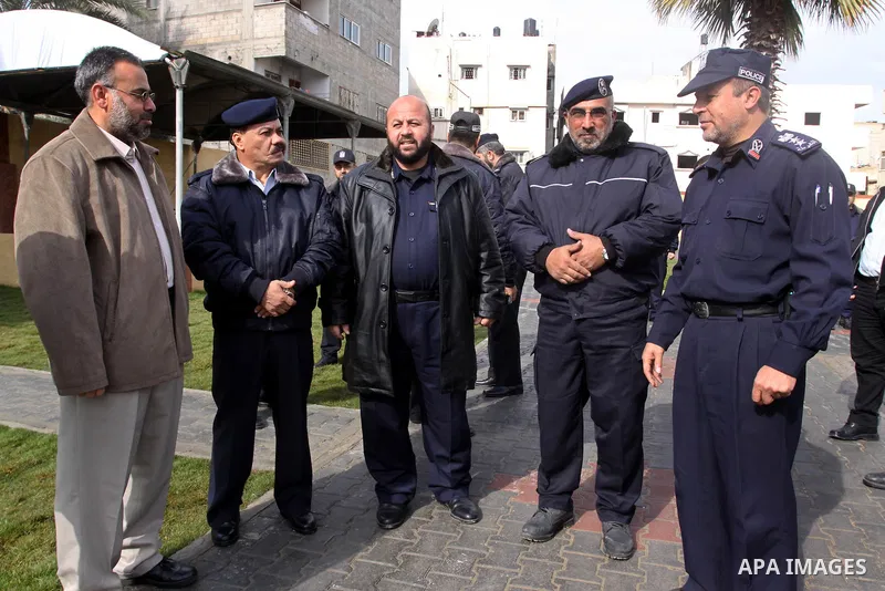 Palestinian policemen in Gaza Strip, take part in opening ceremony of a new police station, in Gaza City on Jan. 15,2011. Photo by Mohammed Asad