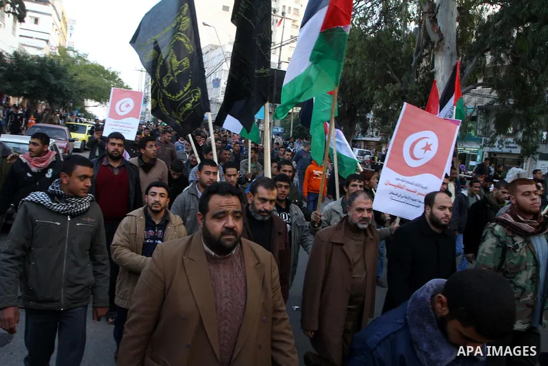 Palestinian Jihad Islamic supporters take part in a protest in solidarity with the Tunisian people in Gaza city on January 15, 2011. The protest confirmed that the two peoples, Palestinian and Tunisian linked by strong t...
