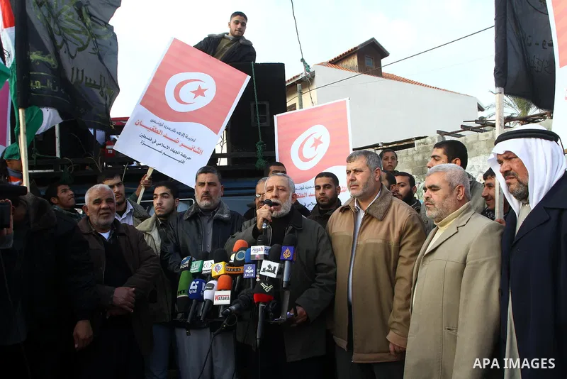 Palestinian Jihad Islamic supporters take part in a protest in solidarity with the Tunisian people in Gaza city on January 15, 2011. The protest confirmed that the two peoples, Palestinian and Tunisian linked by strong t...