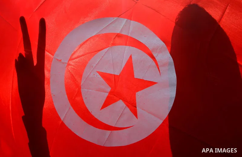 A Palestinian man waves with victory sign during a Hamas rally in Gaza City to show support for the Tunisian people on January 16, 2011. Tunisia's new leadership moved to form a coalition government to gain the upper han...