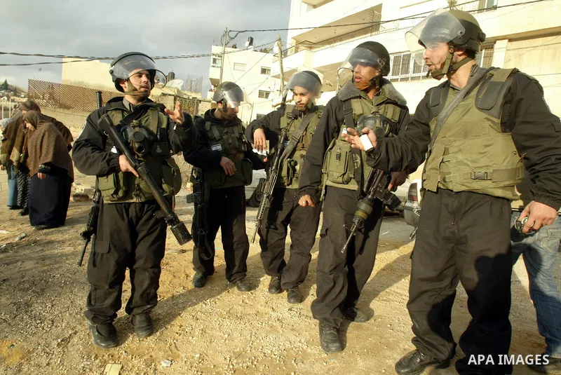 Israeli policemen stand guard during clashes with Palestinian youths in the Arab east Jerusalem neighbourhood of Silwan against Jewish settlement activity in the Palestinian districts of the holy city on Jan. 16, 2011. P...