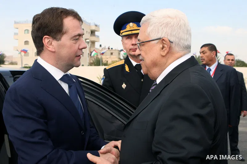 Palestinian President Mahmoud Abbas (R) welcomes Russian President Dmitry Medvedev (L) to an state visit in the West Bank town of Jericho, on 18 January 2011. Medvedev is making a rare visit to the West Bank only for tal...