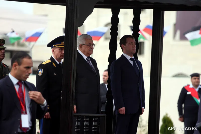 Palestinian President Mahmoud Abbas and Russian President Dmitry Medvedev review an honor guard prior to their meeting in the West Bank town of Jericho, Tuesday, Jan. 18, 2011. Medvedev arrived in the West Bank on Tuesda...
