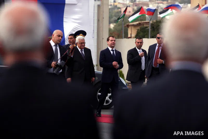 Palestinian President Mahmoud Abbas and Russian President Dmitry Medvedev review an honor guard prior to their meeting in the West Bank town of Jericho, Tuesday, Jan. 18, 2011. Medvedev arrived in the West Bank on Tuesda...