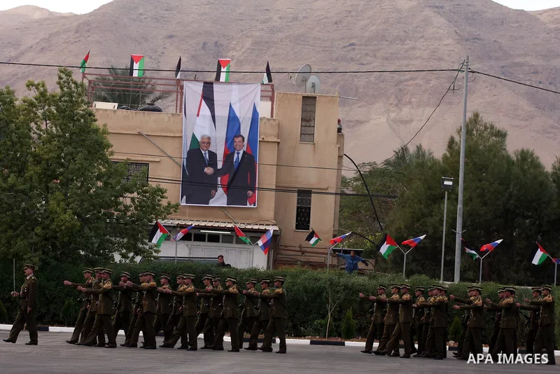 Palestinian President Mahmoud Abbas and Russian President Dmitry Medvedev review an honor guard prior to their meeting in the West Bank town of Jericho, Tuesday, Jan. 18, 2011. Medvedev arrived in the West Bank on Tuesda...