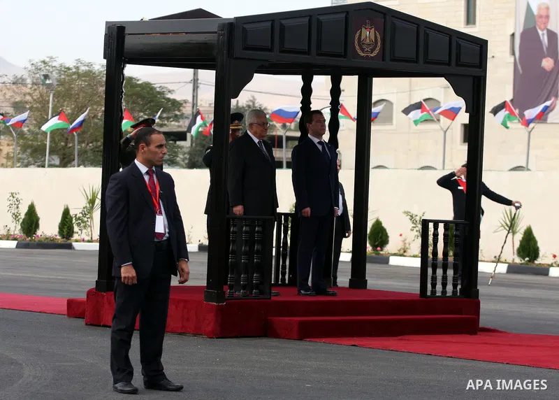 Palestinian President Mahmoud Abbas and Russian President Dmitry Medvedev review an honor guard prior to their meeting in the West Bank town of Jericho, Tuesday, Jan. 18, 2011. Medvedev arrived in the West Bank on Tuesda...