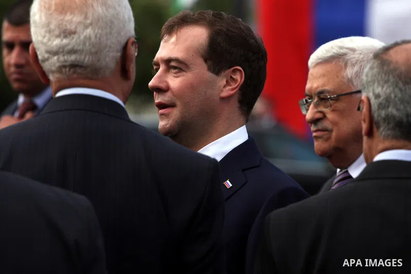 Palestinian President Mahmoud Abbas and Russian President Dmitry Medvedev review an honor guard prior to their meeting in the West Bank town of Jericho, Tuesday, Jan. 18, 2011. Medvedev arrived in the West Bank on Tuesda...