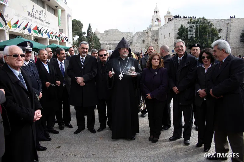 Orthodox Armenian take part in a procession outside the Church of the Nativity in the West Bank town of Bethlehem on Christmas Eve, January 18, 2011. While most Armenians celebrate Christmas on January 6th, the Orthodox...