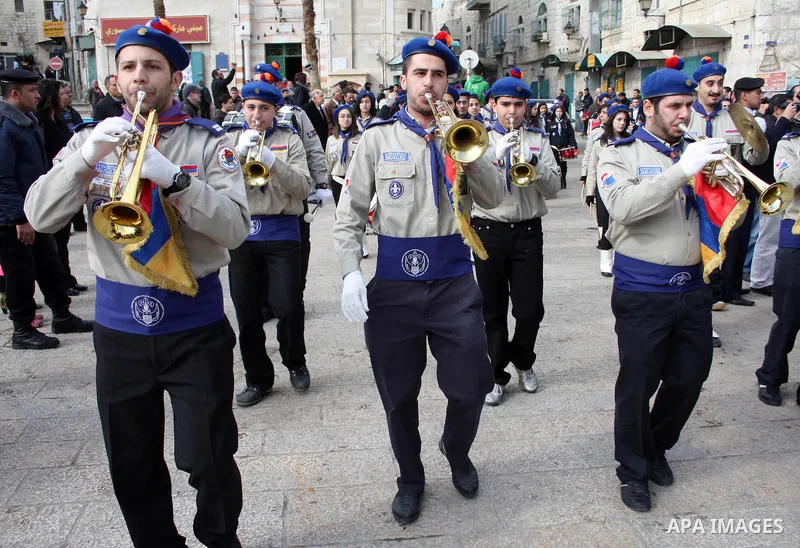 Orthodox Armenian take part in a procession outside the Church of the Nativity in the West Bank town of Bethlehem on Christmas Eve, January 18, 2011. While most Armenians celebrate Christmas on January 6th, the Orthodox...