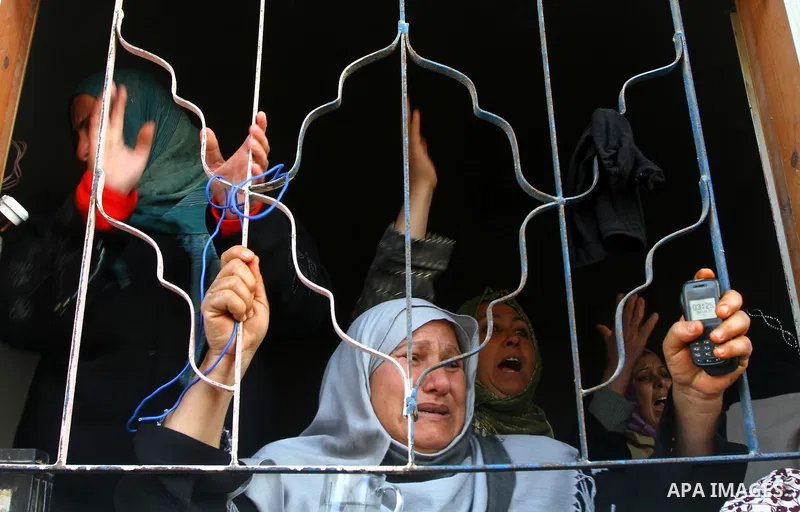 Palestinian women react during the funeral of Amjad al-Zaaneen, in Beit Hanoun, northern Gaza Strip, Tuesday, Jan. 18, 2011. A medical official in the Gaza Strip al-Zaaneen was killed and two others wounded in violence a...