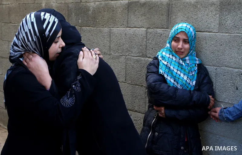 Palestinian women react during the funeral of Amjad al-Zaaneen, in Beit Hanoun, northern Gaza Strip, Tuesday, Jan. 18, 2011. A medical official in the Gaza Strip al-Zaaneen was killed and two others wounded in violence a...