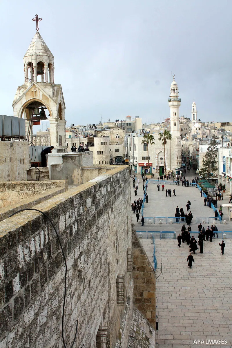 The Church of the Nativity and the 19th century mosque of Omar ibn al-Khattab looks over Manger Square on January 18, 2011 in Bethlehem, West Bank. The city square, which on Christmas Eve is filled with pilgrims and loca...