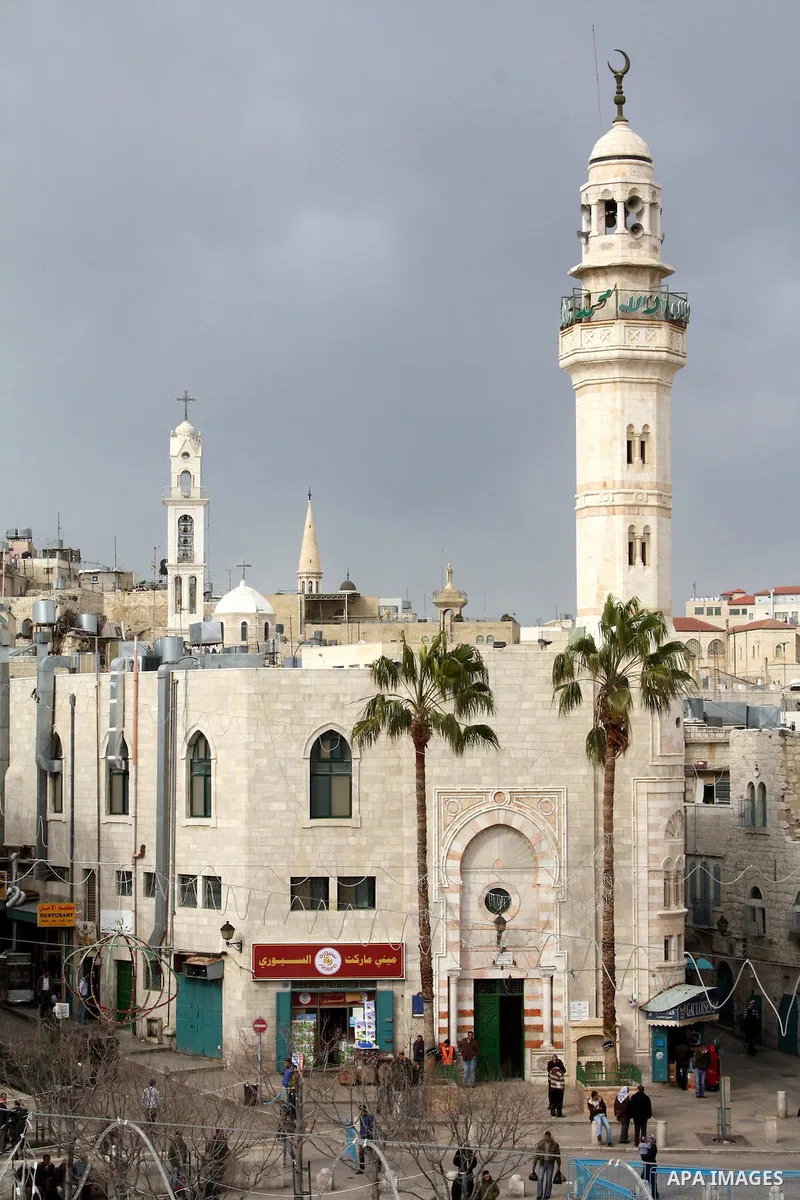 The 19th century mosque of Omar ibn al-Khattab looks over Manger Square towards the Church of the Nativity on January 18, 2011 in Bethlehem, West Bank. The city square, which on Christmas Eve is filled with pilgrims and...
