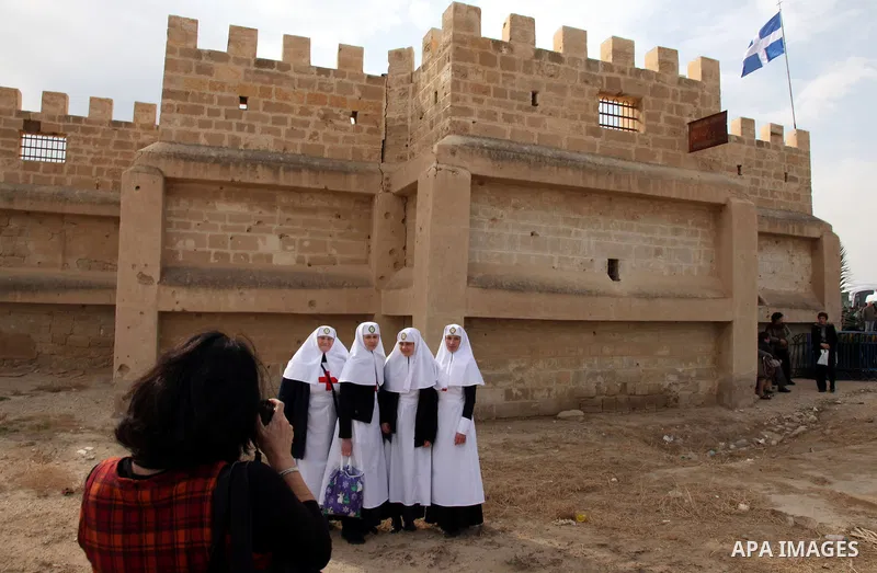 Christian Orthodox pilgrims attend a traditional Epiphany ceremony, at the baptismal site of Qasr el Yahud, the spot where John the Baptist is said to have baptized Jesus, near the West Bank town of Jericho, Tuesday, Jan...