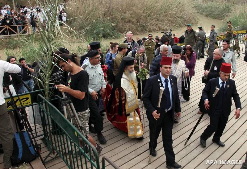 The Greek Orthodox patriarch of Jerusalem Theophilos III takes part the a traditional Epiphany ceremony, at the baptismal site of Qasr el Yahud, the spot where John the Baptist is said to have baptized Jesus, near the We...