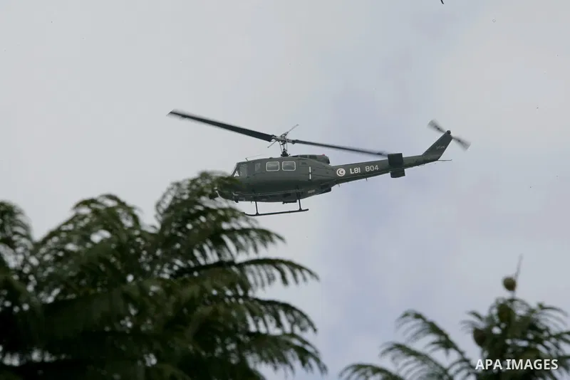A military helicopter is seen in the streets of Tunis, Tunisia, 18 January 2011. Tunisian protesters called for the abolition of ousted president Zine El Abidine Ben Ali's ruling party on January 17 amid a chaotic power...