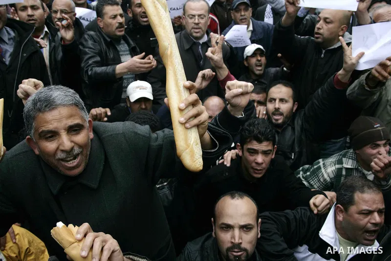 Protestors participate in a demonstration in downtown Tunis Jan. 18, 2011. Thousands of Tunisians flood the streets in downtown Tunis protesting against the interim government only one day after it was established. Photo...