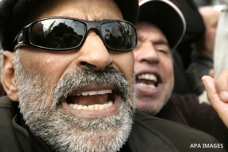 Tunisians take part in a protest calling the former ruling party the Constitutional Democratic Rally (RCD) to withdraw from the newly formed interim government in Tunis, Tunisia, 19 January 2011. Tunisia's transitional g...