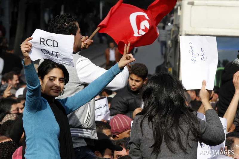 Tunisians take part in a protest calling the former ruling party the Constitutional Democratic Rally (RCD) to withdraw from the newly formed interim government in Tunis, Tunisia, 19 January 2011. Tunisia's transitional g...