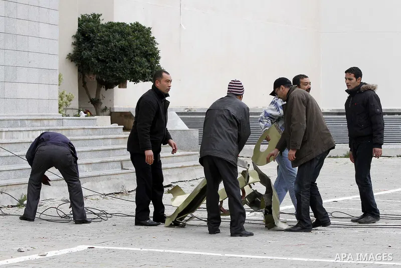 Tunisians take part in a protest in front of the headquarters of the Constitutional Democratic Rally (RCD) party of ousted president Zine al-Abidine Ben Ali during a demonstration in downtown Tunis, January 20, 2011. Tun...