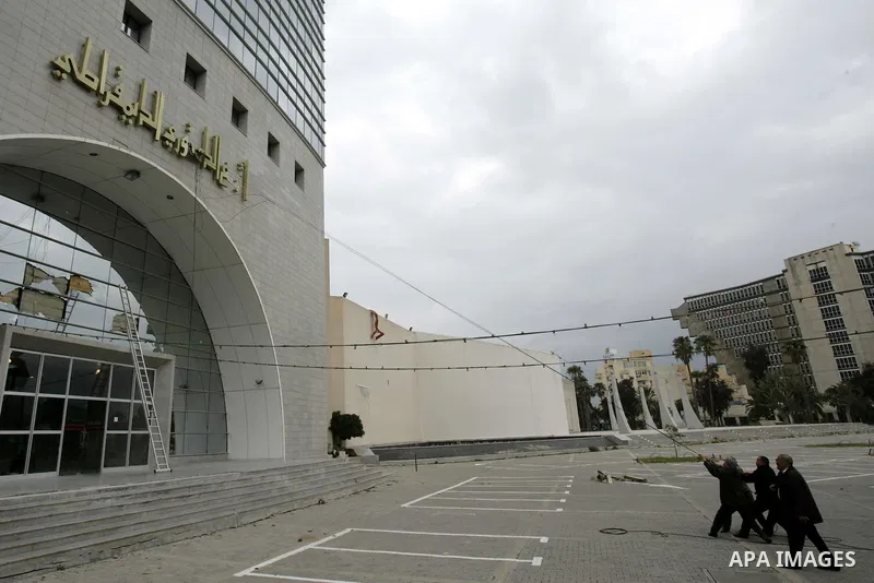 Tunisians take part in a protest in front of the headquarters of the Constitutional Democratic Rally (RCD) party of ousted president Zine al-Abidine Ben Ali during a demonstration in downtown Tunis, January 20, 2011. Tun...