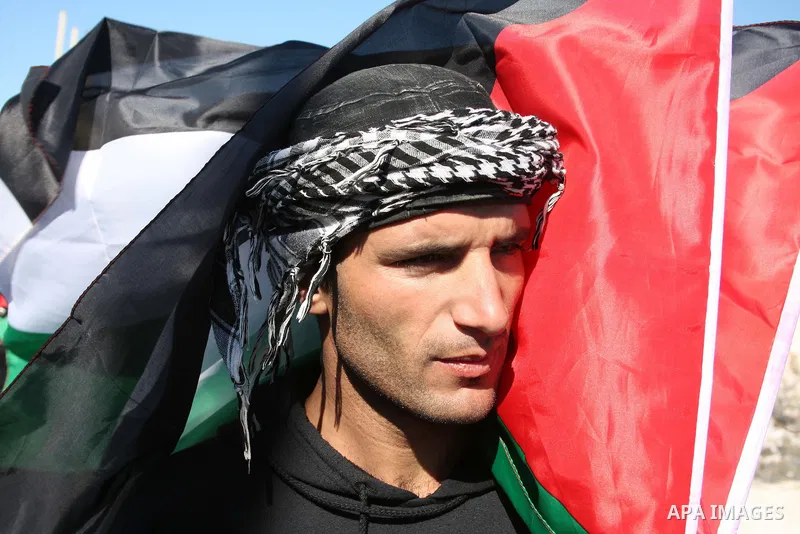 Palestinian, Israeli and foreign protesters take part in a demonstration against Israel's controversial separation barrier in the West Bank village of Maasarah, near Bethlehem, on January 21, 2011. Israel says the networ...